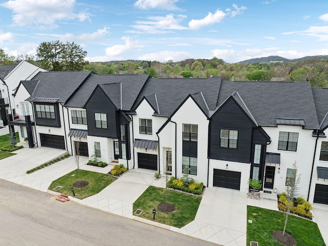 112 Shadow Springs Dr, Brentwood, TN 37027 - view of front of property with a standing seam roof, stucco siding, driveway, and a garage