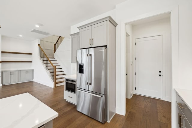 112 Shadow Springs Dr, Brentwood, TN 37027 - kitchen with gray cabinetry, dark wood finished floors, visible vents, high end refrigerator, and baseboards
