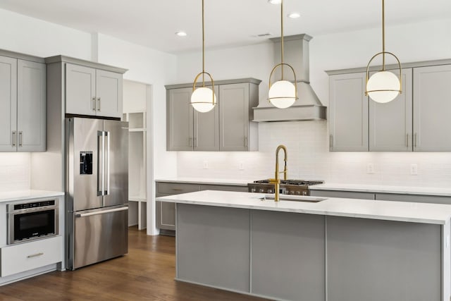 112 Shadow Springs Dr, Brentwood, TN 37027 - kitchen featuring custom exhaust hood, dark wood-style flooring, stainless steel appliances, decorative backsplash, and gray cabinetry