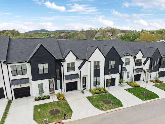 112 Shadow Springs Dr, Brentwood, TN 37027 - view of front of property with board and batten siding, driveway, a standing seam roof, and roof with shingles