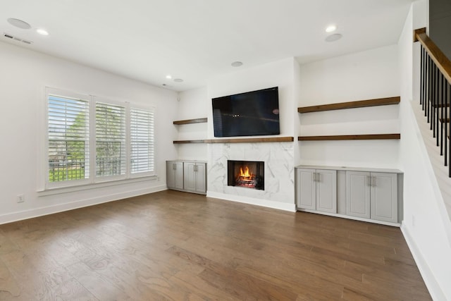 112 Shadow Springs Dr, Brentwood, TN 37027 - unfurnished living room featuring a high end fireplace, visible vents, baseboards, and wood finished floors