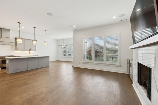 112 Shadow Springs Dr, Brentwood, TN 37027 - unfurnished living room with a large fireplace, visible vents, recessed lighting, baseboards, and dark wood-style floors