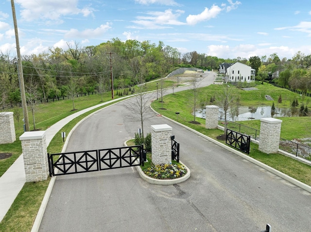 112 Shadow Springs Dr, Brentwood, TN 37027 - view of road featuring a gate, a gated entry, curbs, and a water view
