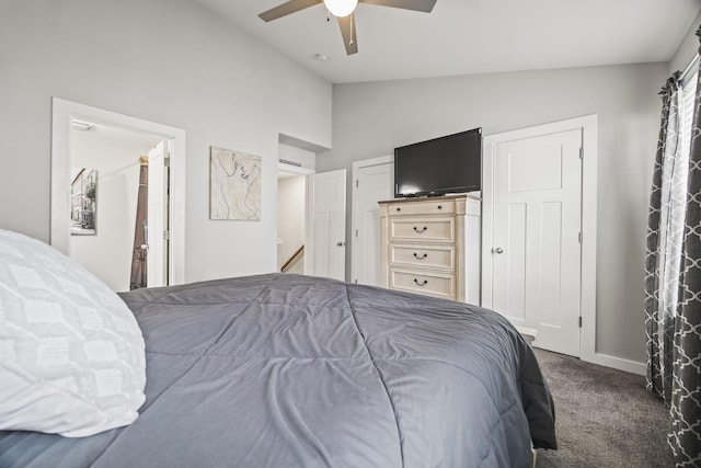 carpeted bedroom featuring a ceiling fan, baseboards, and high vaulted ceiling