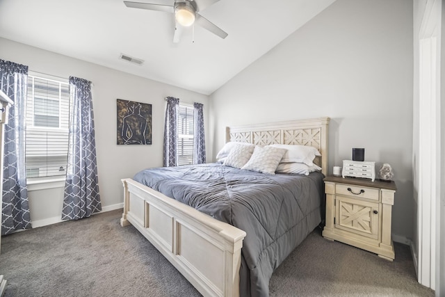 carpeted bedroom with ceiling fan, visible vents, multiple windows, and lofted ceiling