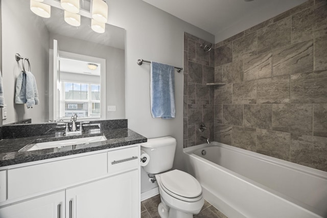 bathroom featuring vanity, bathtub / shower combination, and toilet