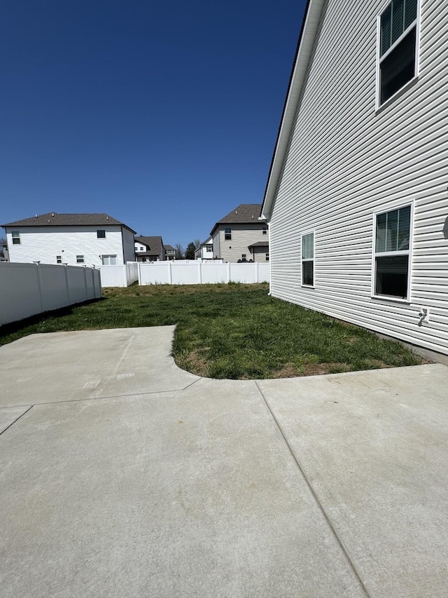 view of yard featuring a patio area and a fenced backyard