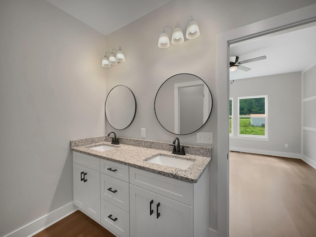 4 Young Branch Rd, Dixon Springs, TN 37057 - bathroom featuring ceiling fan, double vanity, and wood finished floors