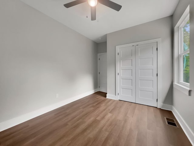 4 Young Branch Rd, Dixon Springs, TN 37057 - unfurnished bedroom featuring wood finished floors, ceiling fan, and a closet