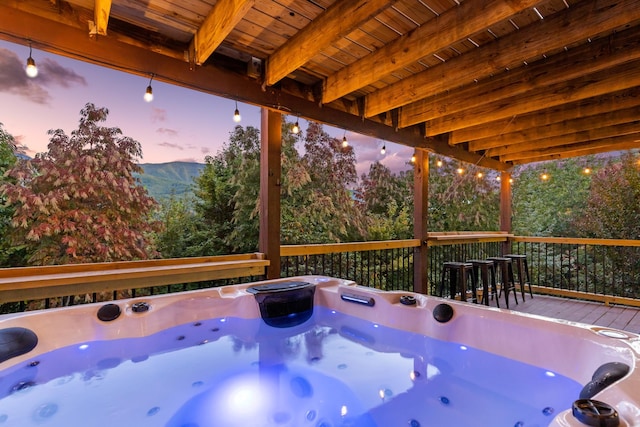 deck featuring a hot tub