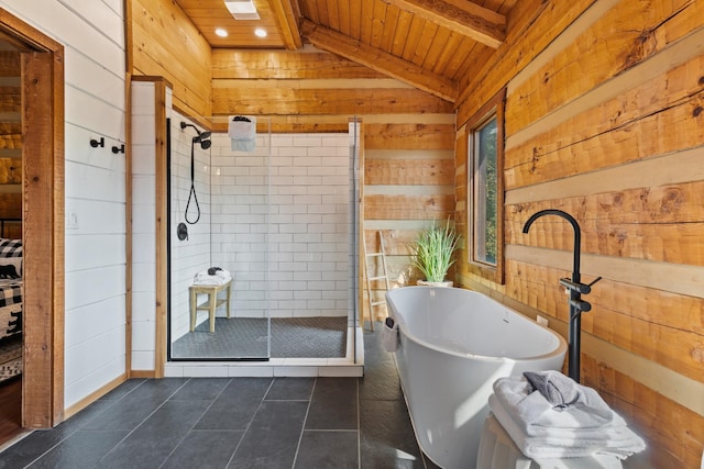 bathroom with lofted ceiling with beams, tile patterned floors, wooden walls, a shower stall, and wooden ceiling
