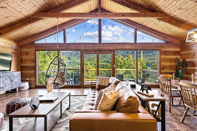 living room with wood walls, wooden ceiling, and lofted ceiling with beams