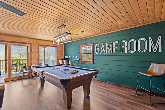 game room with wooden walls, wood finished floors, pool table, and wood ceiling