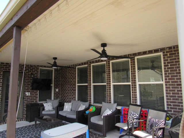 view of patio featuring an outdoor living space and a ceiling fan