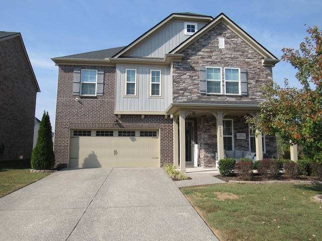 craftsman-style house with concrete driveway, board and batten siding, a front lawn, a porch, and a garage