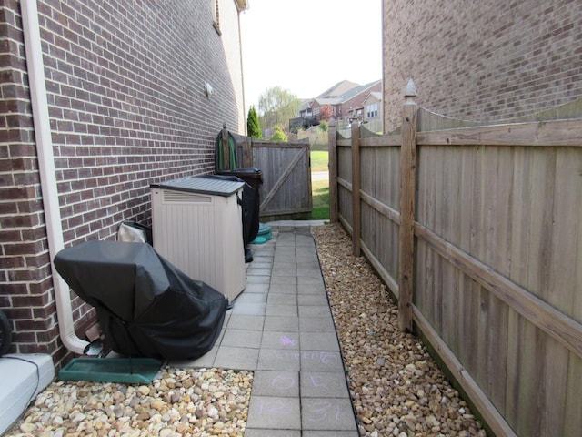 view of patio / terrace featuring grilling area and fence