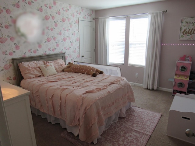 bedroom featuring light carpet and baseboards