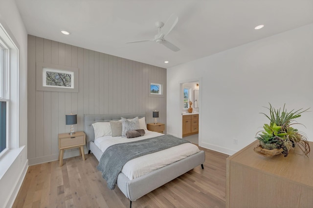 bedroom featuring light wood finished floors, baseboards, and recessed lighting