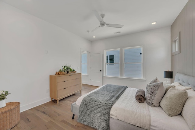 bedroom featuring light wood finished floors, visible vents, and recessed lighting
