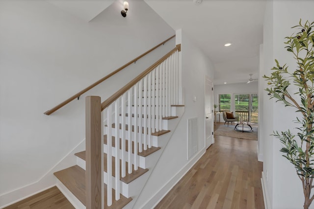 staircase with visible vents, baseboards, ceiling fan, recessed lighting, and wood finished floors