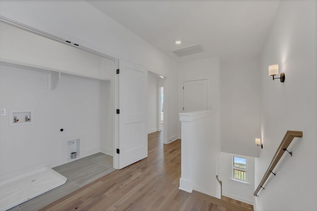 washroom with visible vents, light wood-style floors, laundry area, electric dryer hookup, and hookup for a washing machine