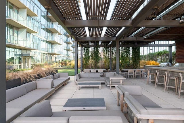 view of patio / terrace featuring an outdoor living space, area for grilling, a pergola, a grill, and outdoor dining area