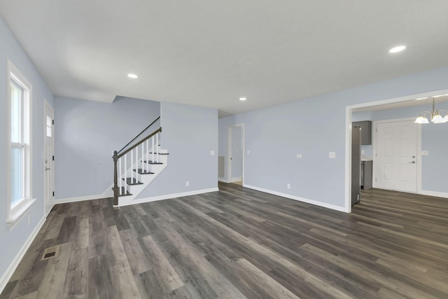 314 Shadowbrook Dr, Smyrna, TN 37167 - unfurnished living room featuring stairway, dark wood-style flooring, baseboards, and visible vents