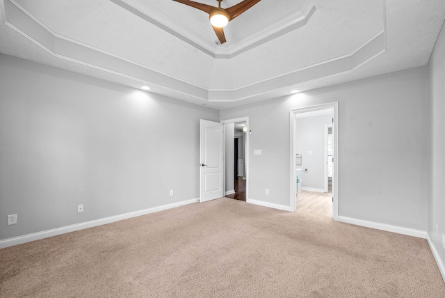 580 Mountain View Dr, Clarksville, TN 37043 - unfurnished bedroom featuring ensuite bathroom, a tray ceiling, baseboards, and carpet floors