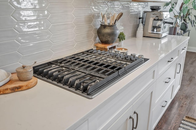 1009 Alpaca Dr, Spring Hill, TN 37174 - interior details featuring light countertops, decorative backsplash, stainless steel gas stovetop, and white cabinets