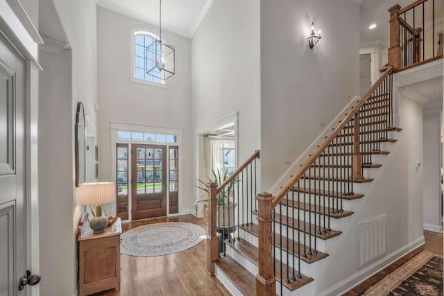 1009 Alpaca Dr, Spring Hill, TN 37174 - foyer with visible vents, wood finished floors, and stairs