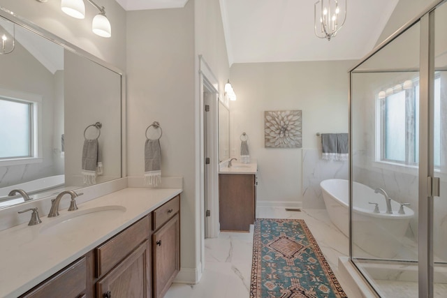 1009 Alpaca Dr, Spring Hill, TN 37174 - bathroom with a soaking tub, a healthy amount of sunlight, marble finish floor, and a sink