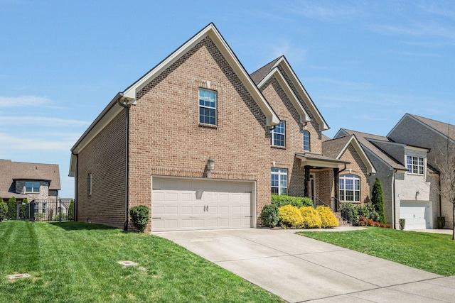 1009 Alpaca Dr, Spring Hill, TN 37174 - view of front of house with a garage, a front yard, driveway, and brick siding
