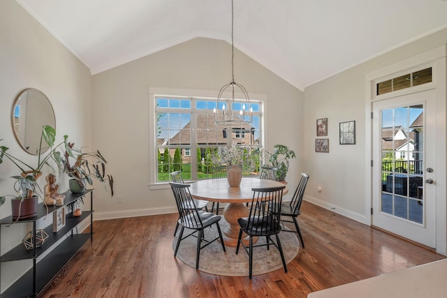 1009 Alpaca Dr, Spring Hill, TN 37174 - dining area with baseboards, wood finished floors, a notable chandelier, and vaulted ceiling