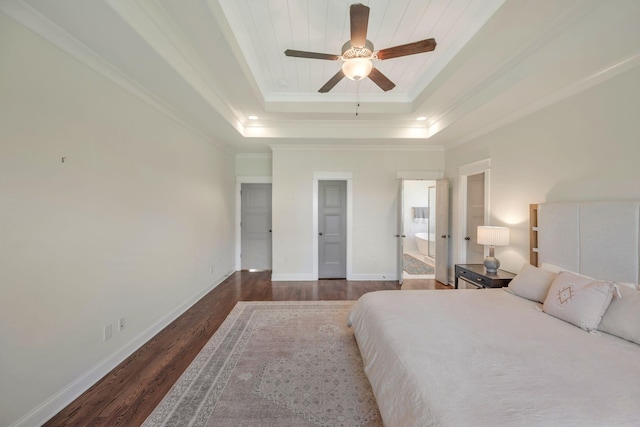 1009 Alpaca Dr, Spring Hill, TN 37174 - bedroom with dark wood-type flooring, a tray ceiling, baseboards, and ornamental molding