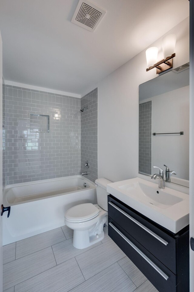 509D Chesterfield Ave, Nashville, TN 37212 - bathroom with visible vents, toilet, vanity, and tub / shower combination