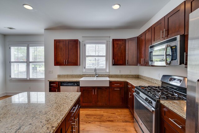 509D Chesterfield Ave, Nashville, TN 37212 - kitchen with a sink, appliances with stainless steel finishes, recessed lighting, and light stone countertops