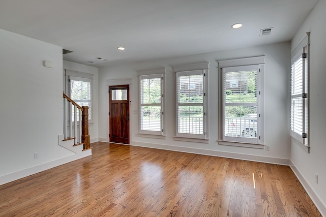 509D Chesterfield Ave, Nashville, TN 37212 - foyer entrance with a wealth of natural light, stairs, light wood-style flooring, and baseboards