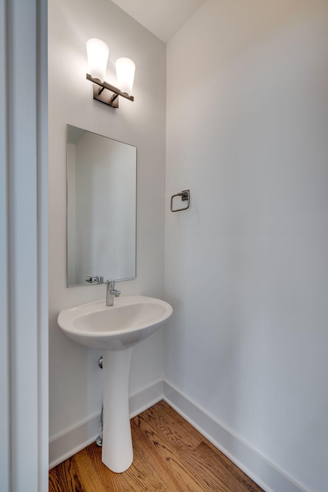 509D Chesterfield Ave, Nashville, TN 37212 - bathroom with a sink, baseboards, and wood finished floors