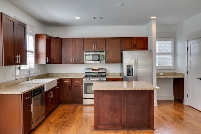 509D Chesterfield Ave, Nashville, TN 37212 - kitchen with a sink, light wood-style floors, recessed lighting, light stone countertops, and stainless steel appliances