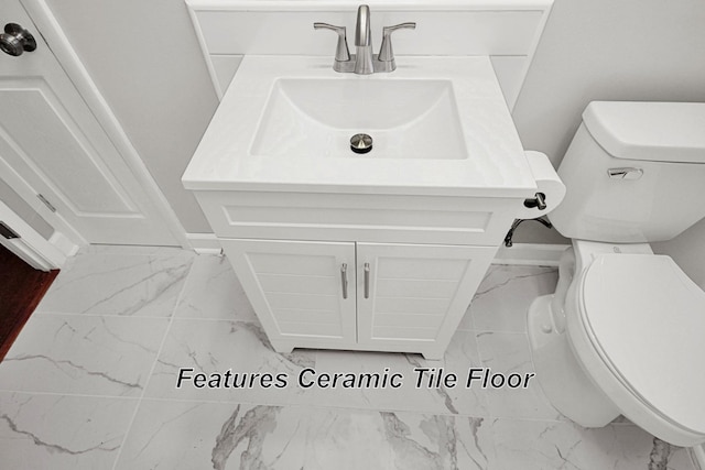 216 Belding Dr, Nashville, TN 37214 - bathroom with toilet, marble finish floor, baseboards, and vanity