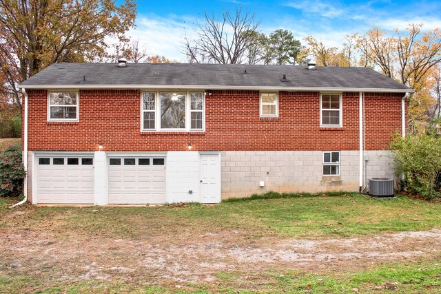 216 Belding Dr, Nashville, TN 37214 - view of side of property featuring brick siding, central AC, a garage, and a lawn