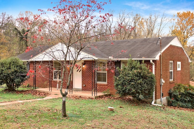 216 Belding Dr, Nashville, TN 37214 - ranch-style home with a front yard, brick siding, and a patio area