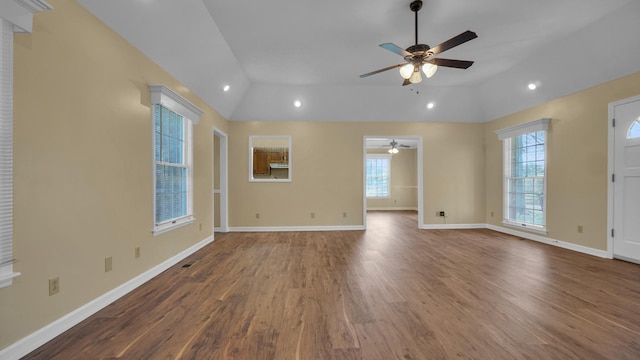 unfurnished living room featuring a ceiling fan, plenty of natural light, wood finished floors, and lofted ceiling