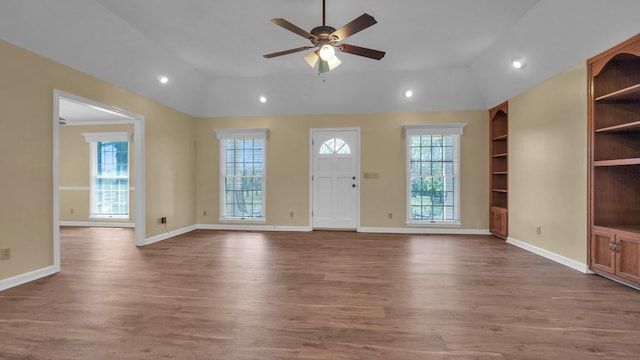 interior space with wood finished floors, ceiling fan, vaulted ceiling, and recessed lighting