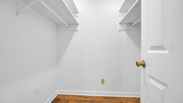 spacious closet with wood finished floors