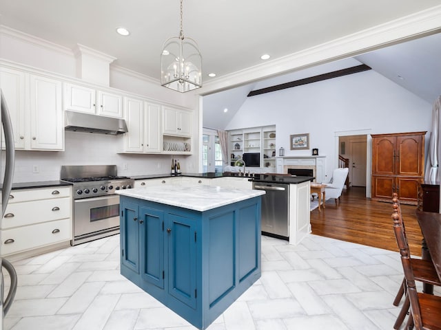 1698 Burke Hollow Rd, Nolensville, TN 37135 - kitchen with vaulted ceiling, a center island, under cabinet range hood, stainless steel appliances, and blue cabinets
