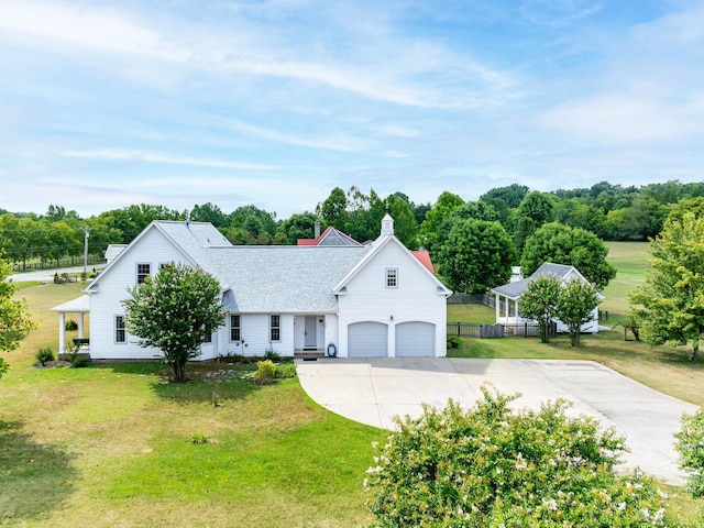 1698 Burke Hollow Rd, Nolensville, TN 37135 - view of front of house featuring a front yard, an attached garage, fence, and concrete driveway