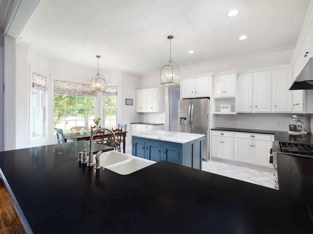 1698 Burke Hollow Rd, Nolensville, TN 37135 - kitchen featuring white cabinets, a kitchen island, a chandelier, appliances with stainless steel finishes, and a sink