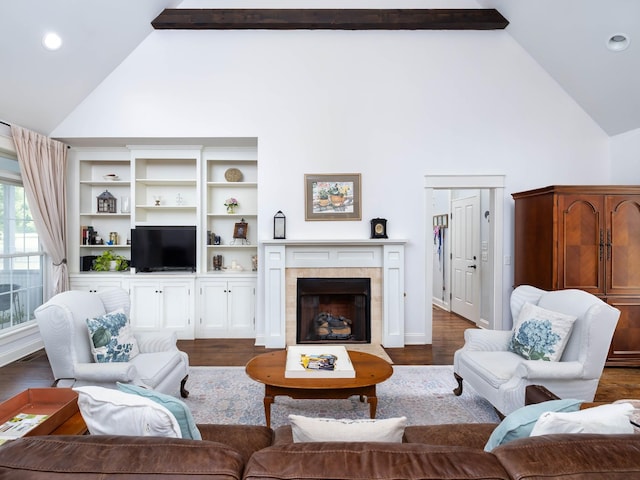 1698 Burke Hollow Rd, Nolensville, TN 37135 - living area featuring beamed ceiling, high vaulted ceiling, a tiled fireplace, and dark wood-style flooring