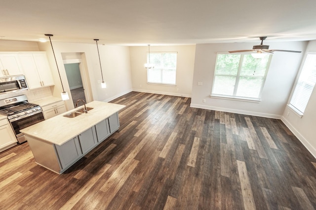 224 Griffin Ln, Gallatin, TN 37066 - living room featuring a ceiling fan, baseboards, and dark wood-style floors